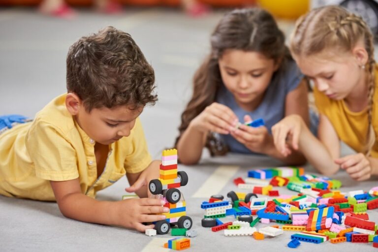 Creative Center children building together with colorful blocks